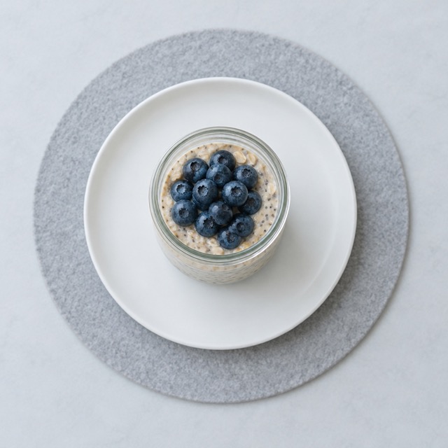 Overnight oats jar and boiled eggs set out for a simple GLP-1 breakfast and snack